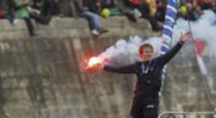 French skipper Gabart holds a warning flare as he celebrates his victory in the Vendee Globe sailing race, in the channel of the harbor at Les Sables d'Olonne