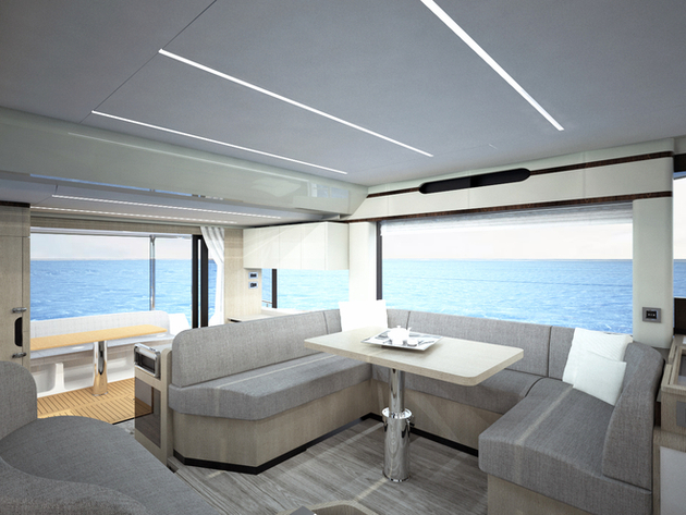 Sur le pont principal, le cockpit et le carré sont baignés de lumière grâce aux larges baies vitrées et à la porte coulissante qui offre un accès direct à la mer. Nautisme Article