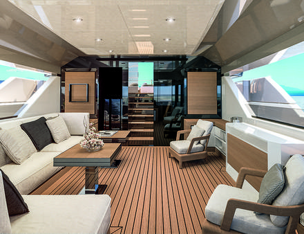Les pavois situés le long de tout le cockpit sont munis d'ouvertures design permettant en outre aux invités, assis sur les divans ou à table de profiter pleinement du panorama. Nautisme Article