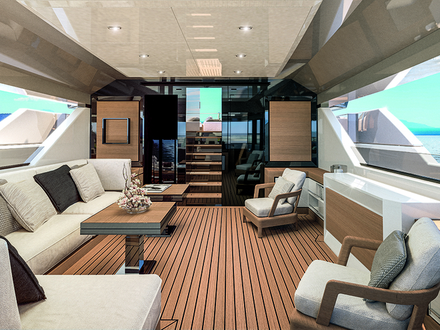 Les pavois situés le long de tout le cockpit sont munis d'ouvertures design permettant en outre aux invités, assis sur les divans ou à table de profiter pleinement du panorama. Nautisme Article
